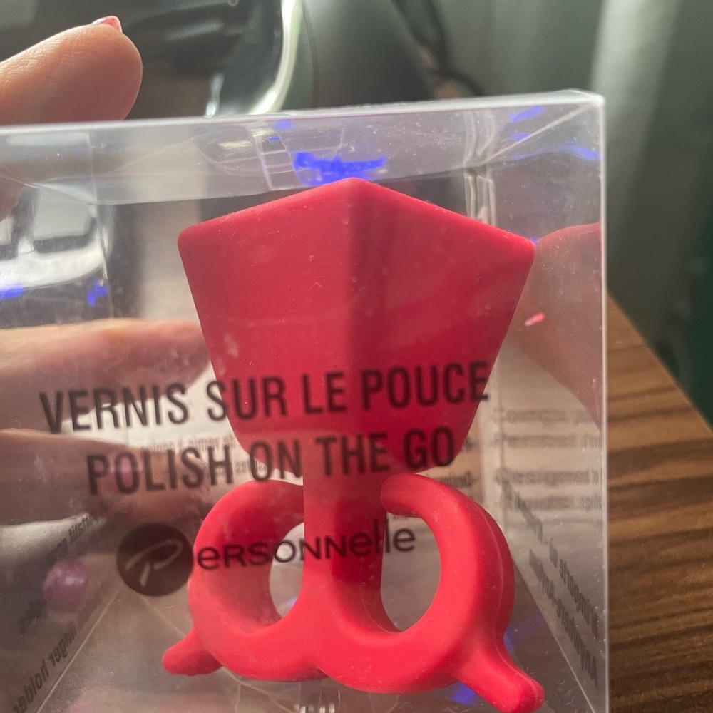 Nail polish finger holder